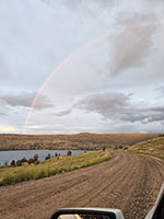 Rainbow over Ring Lake on the road to the Glacier Train trailhead.