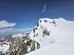 About the mid point of the summit ridge. True summit is the high point to the right.
